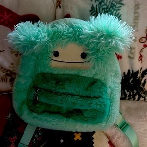 Squishmellow back pack and earmuffs it’s faux fur